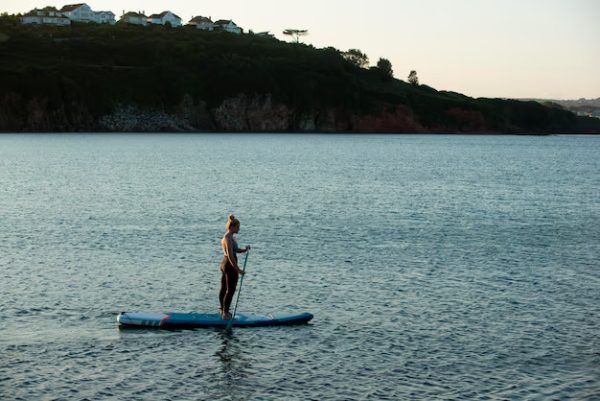 Sports – Long Shot Woman Paddleboarding