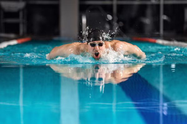 Sports – Male Swimmer Swimming Butterfly