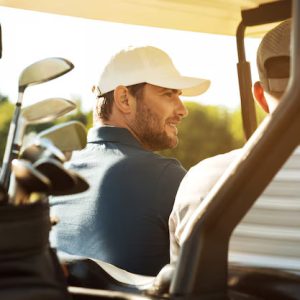 Sports – Two Male Golfers Sitting