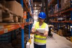 Technology – Warehouse Worker Writing Down