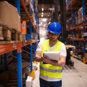 Technology – Warehouse Worker Writing Down
