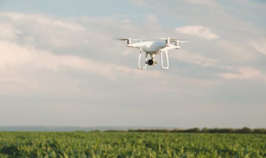white-drone-hovering-bright-blue-sky_158595-3342