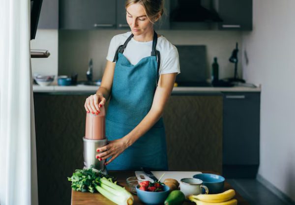 Food – Woman Preparing Smoothie Kitchen