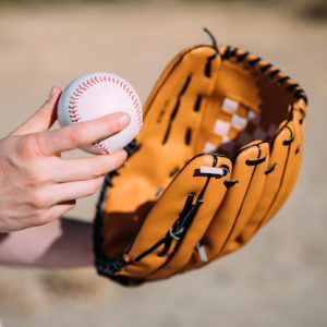 Sports – Young Woman With Baseball